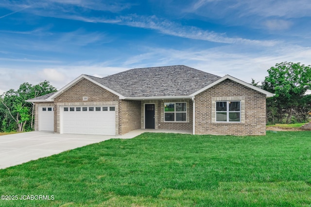 209 Gavin Ln, Linn, MO 65051 - view of front of property featuring a garage, a front yard, concrete driveway, and brick siding