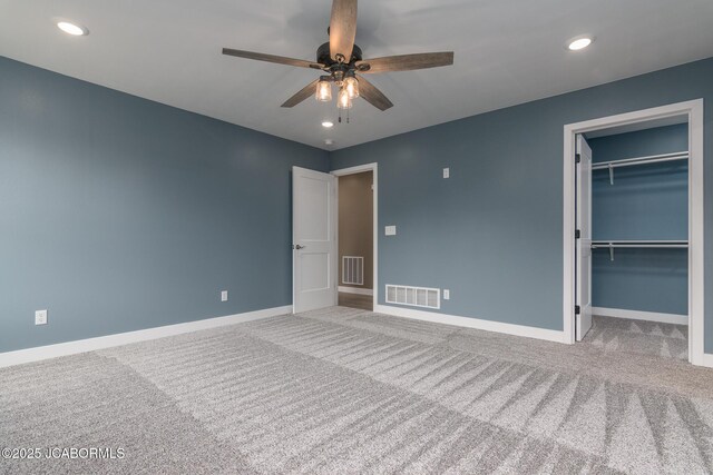 209 Gavin Ln, Linn, MO 65051 - unfurnished bedroom with carpet, a walk in closet, recessed lighting, a closet, and ceiling fan