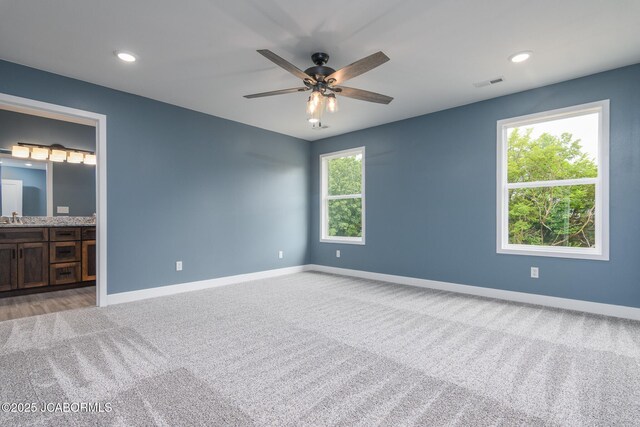 209 Gavin Ln, Linn, MO 65051 - unfurnished bedroom with light colored carpet, ensuite bathroom, recessed lighting, and ceiling fan