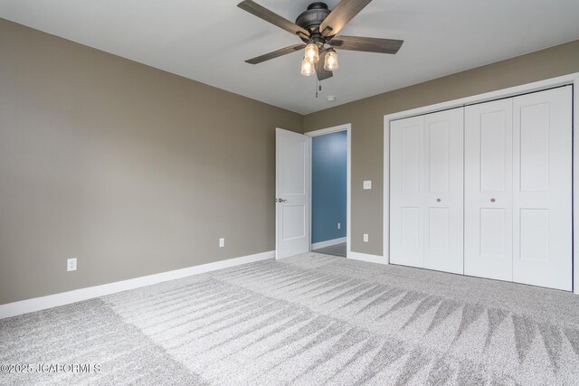209 Gavin Ln, Linn, MO 65051 - unfurnished bedroom with carpet, a closet, and a ceiling fan