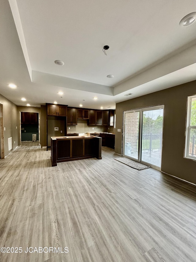 209 Gavin Ln, Linn, MO 65051 - kitchen with light wood-style floors, dark brown cabinetry, light countertops, and recessed lighting