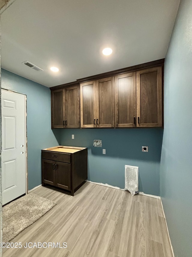 209 Gavin Ln, Linn, MO 65051 - washroom featuring cabinet space, light wood finished floors, hookup for an electric dryer, baseboards, and recessed lighting