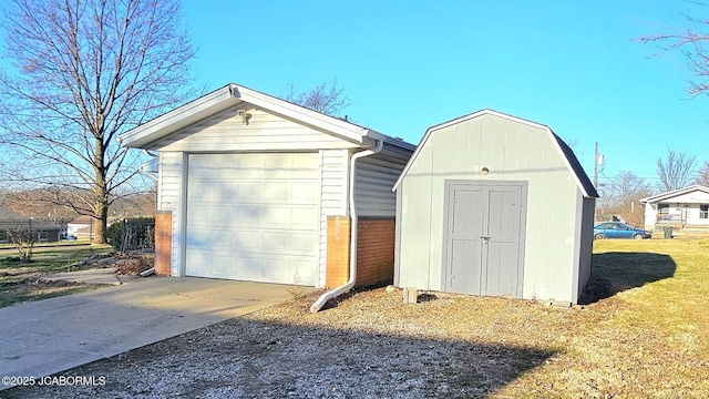 garage featuring concrete driveway