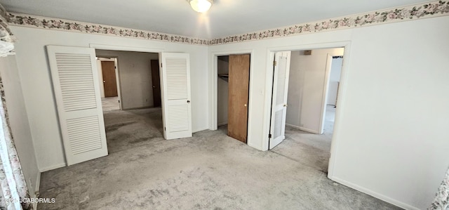 unfurnished bedroom with baseboards and carpet floors