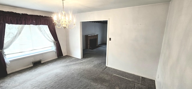 unfurnished room featuring visible vents, baseboards, a notable chandelier, and carpet flooring