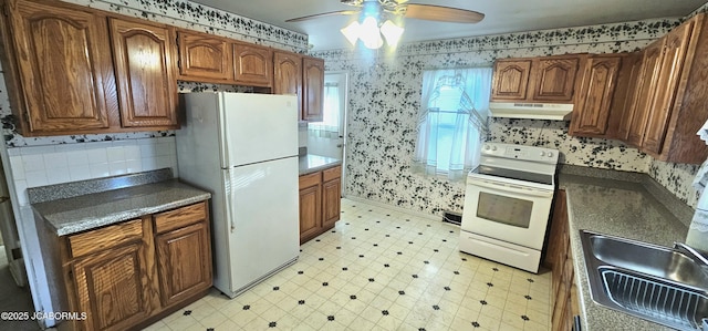 kitchen featuring wallpapered walls, ceiling fan, under cabinet range hood, light floors, and white appliances