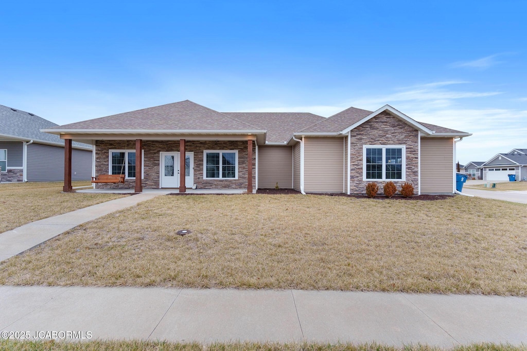 single story home with a porch and a front yard