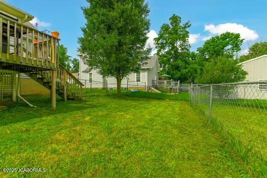 409 E 9th St, Fulton, MO 65251 - view of yard with stairs and a deck