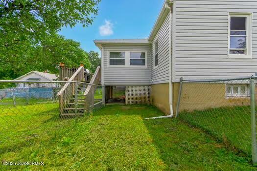 409 E 9th St, Fulton, MO 65251 - back of house featuring stairway