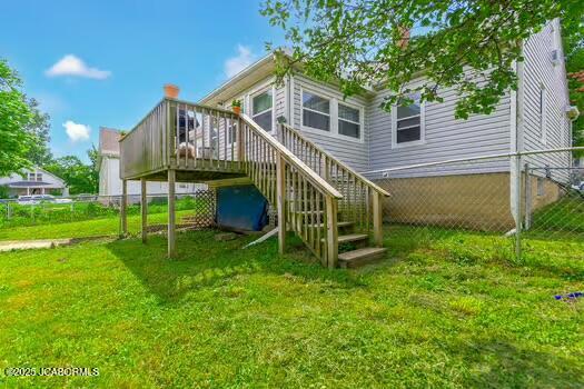409 E 9th St, Fulton, MO 65251 - rear view of house with a wooden deck and stairs