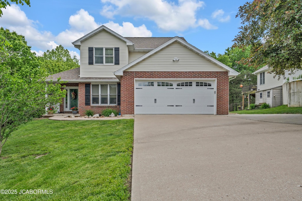 1505 Independence Dr, Jefferson City, MO 65109 - traditional-style home featuring driveway, brick siding, roof with shingles, a front lawn, and a garage