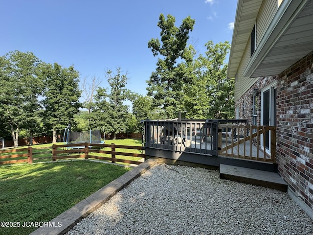 128 Don Dr, Linn, MO 65051 - view of yard featuring a trampoline and a deck