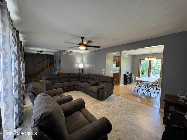 128 Don Dr, Linn, MO 65051 - living area with a ceiling fan, stairs, and a chandelier