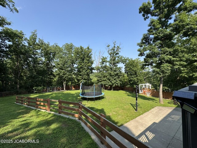 128 Don Dr, Linn, MO 65051 - view of yard featuring a playground and a trampoline