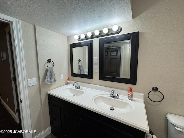 128 Don Dr, Linn, MO 65051 - bathroom featuring double vanity and a textured ceiling