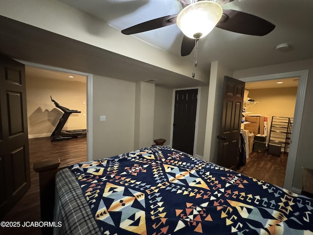 128 Don Dr, Linn, MO 65051 - bedroom with dark wood finished floors and ceiling fan