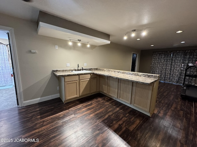 128 Don Dr, Linn, MO 65051 - kitchen featuring dark wood-type flooring, a peninsula, light stone countertops, light brown cabinetry, and recessed lighting
