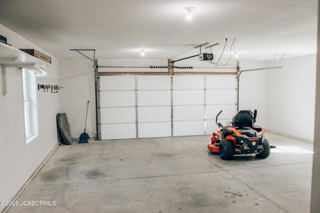 138 Stonegate Ave, Linn, MO 65051 - garage featuring a garage door opener and baseboards