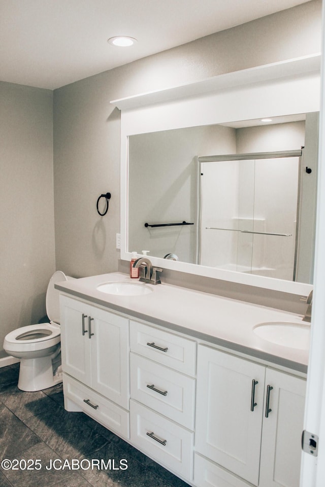 138 Stonegate Ave, Linn, MO 65051 - full bathroom with double vanity, toilet, tile patterned flooring, recessed lighting, and a shower