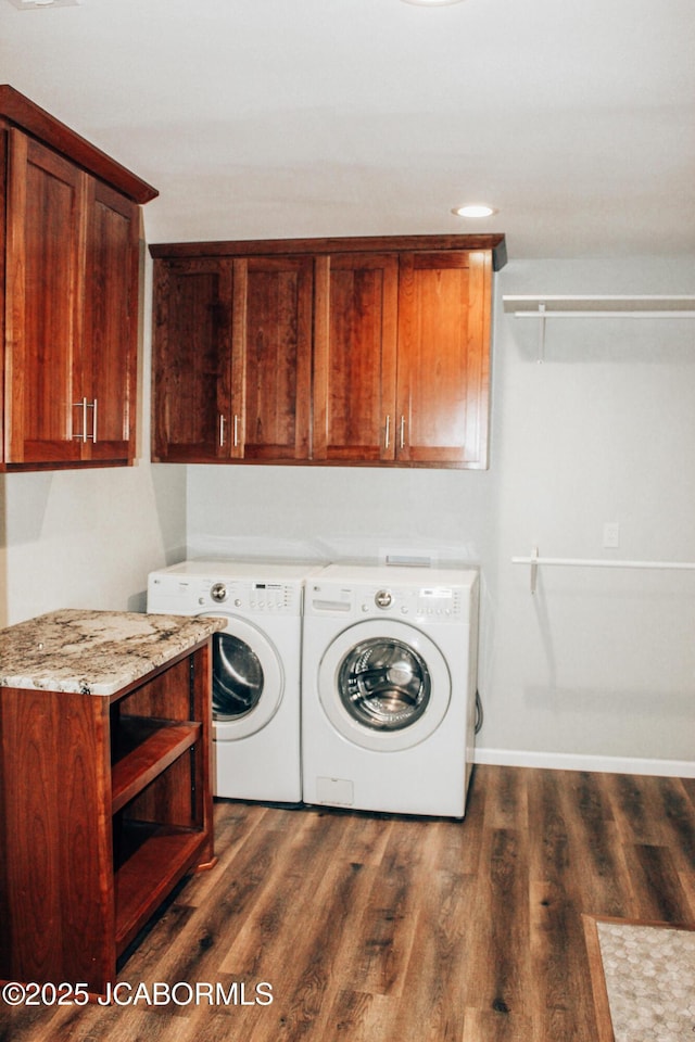 138 Stonegate Ave, Linn, MO 65051 - washroom with cabinet space, washing machine and dryer, dark wood-style flooring, and baseboards