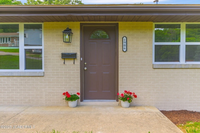 1906 Swifts Hwy, Jefferson City, MO 65109 - doorway to property with brick siding