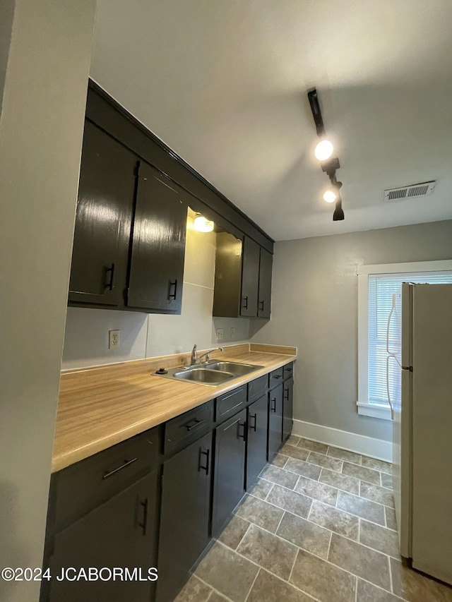 kitchen with white fridge and sink