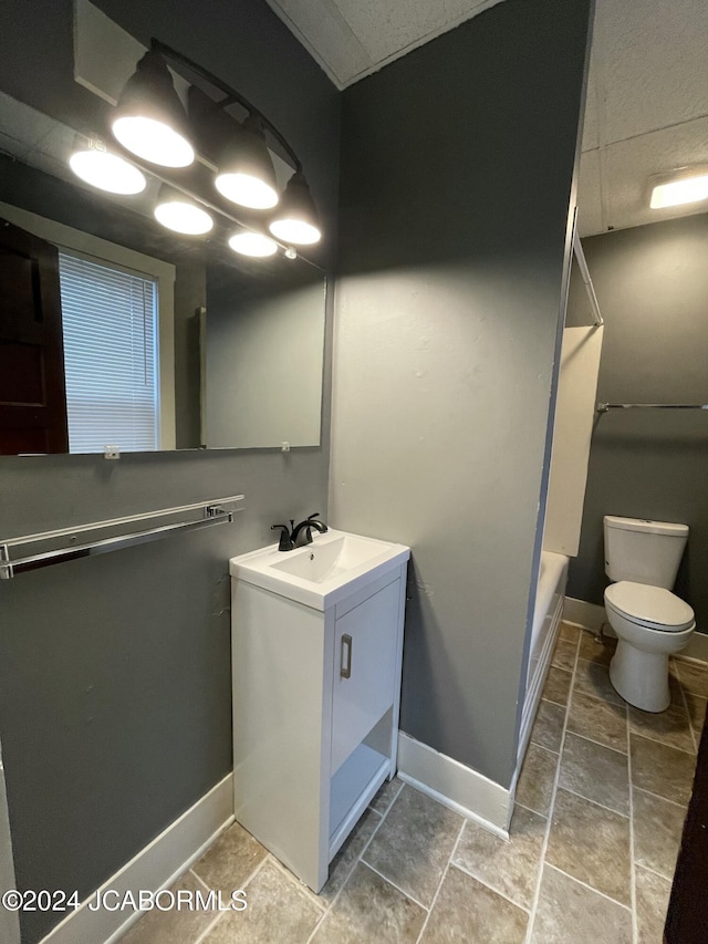 full bathroom featuring shower / tub combination, vanity, and toilet