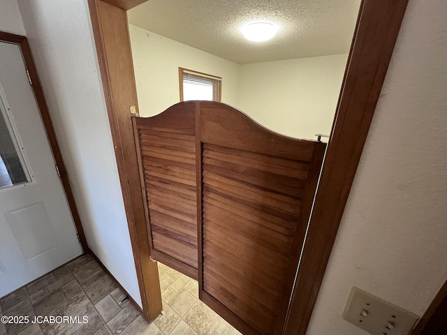 2362 County Road 4032, Holts Summit, MO 65043 - unfurnished bedroom with a textured ceiling and a closet