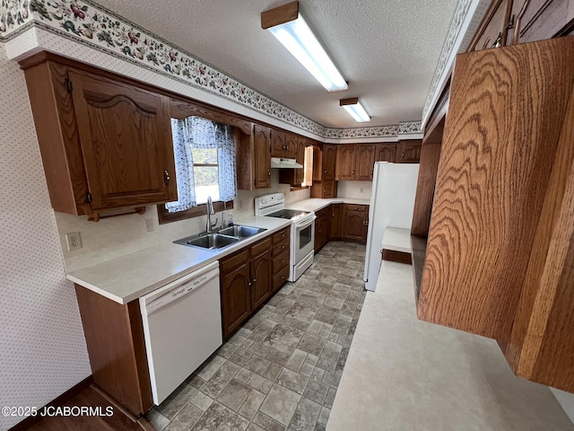 2362 County Road 4032, Holts Summit, MO 65043 - kitchen featuring white appliances, sink, and a textured ceiling