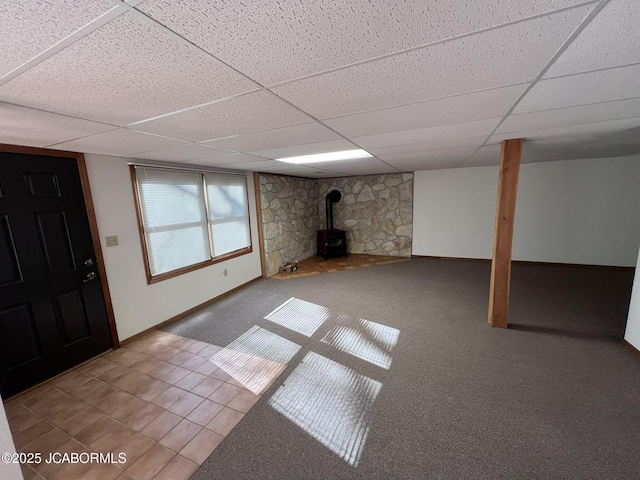 2362 County Road 4032, Holts Summit, MO 65043 - basement featuring a wood stove and a paneled ceiling