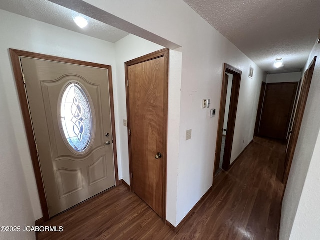 2362 County Road 4032, Holts Summit, MO 65043 - entryway featuring dark hardwood / wood-style floors and a textured ceiling