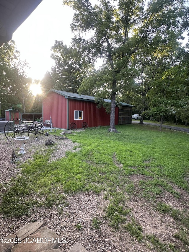 11 Copperhead Rd, Eldon, MO 65026 - view of green lawn with an outdoor structure and an outbuilding