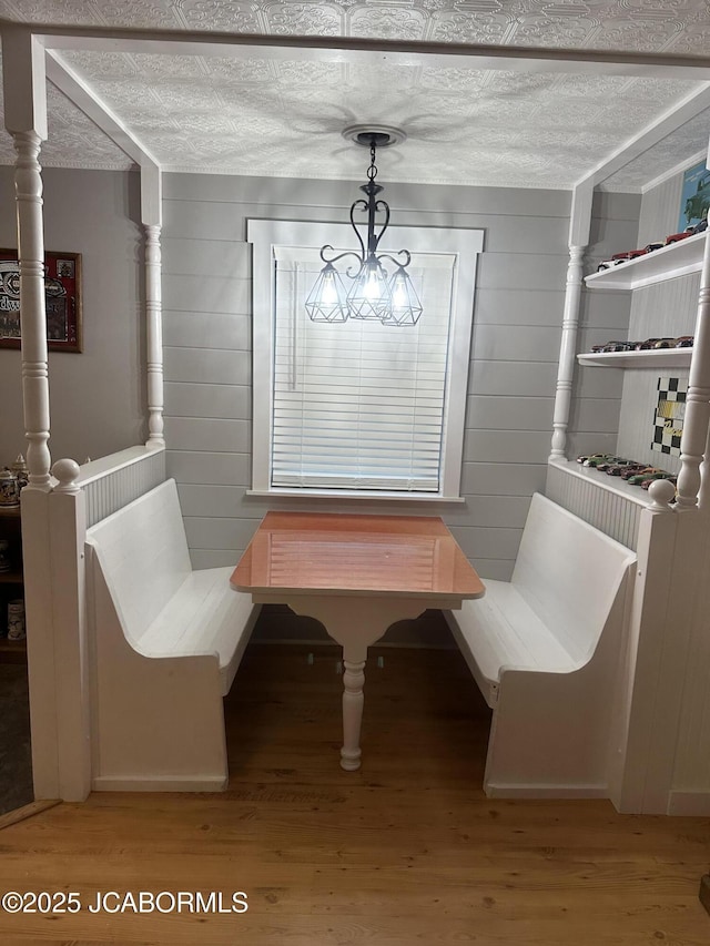 11 Copperhead Rd, Eldon, MO 65026 - dining area with light wood-style flooring and wooden walls