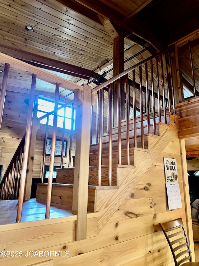11 Copperhead Rd, Eldon, MO 65026 - staircase featuring a high ceiling and wooden walls