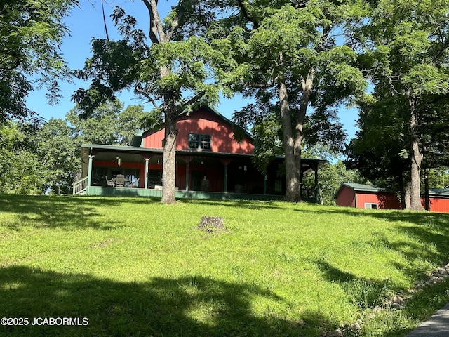 11 Copperhead Rd, Eldon, MO 65026 - back of house with a lawn and an outdoor structure