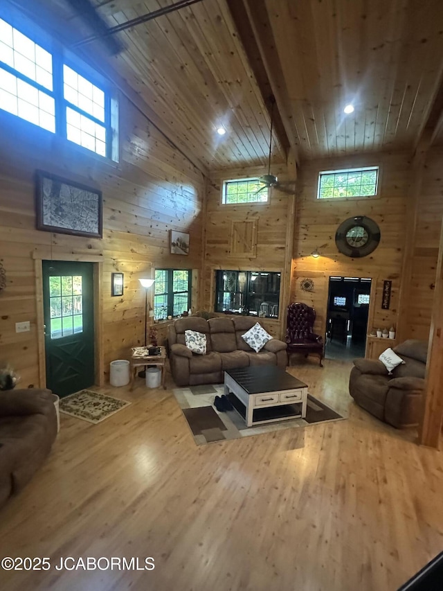 11 Copperhead Rd, Eldon, MO 65026 - living area featuring high vaulted ceiling, wood finished floors, wooden walls, and wood ceiling