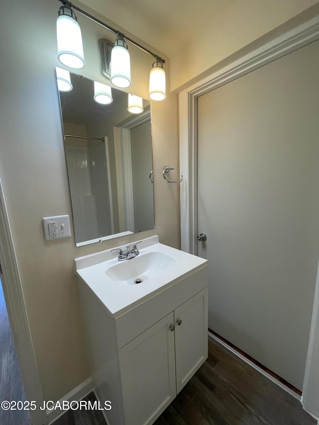 106 S Main St, Chamois, MO 65024 - bathroom with vanity and wood finished floors