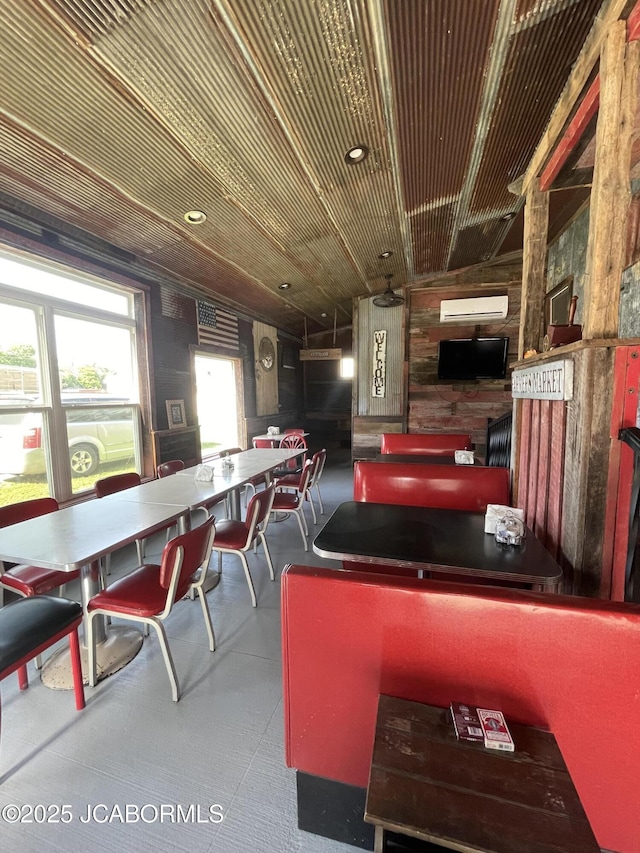 106 S Main St, Chamois, MO 65024 - recreation room featuring a wall mounted AC and wood walls