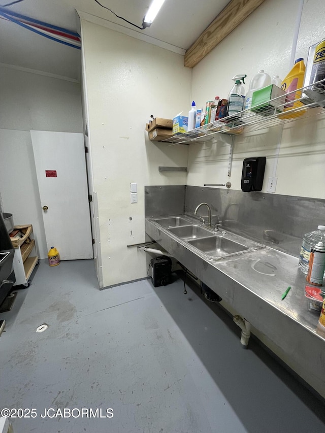 106 S Main St, Chamois, MO 65024 - kitchen featuring concrete flooring, a sink, and open shelves