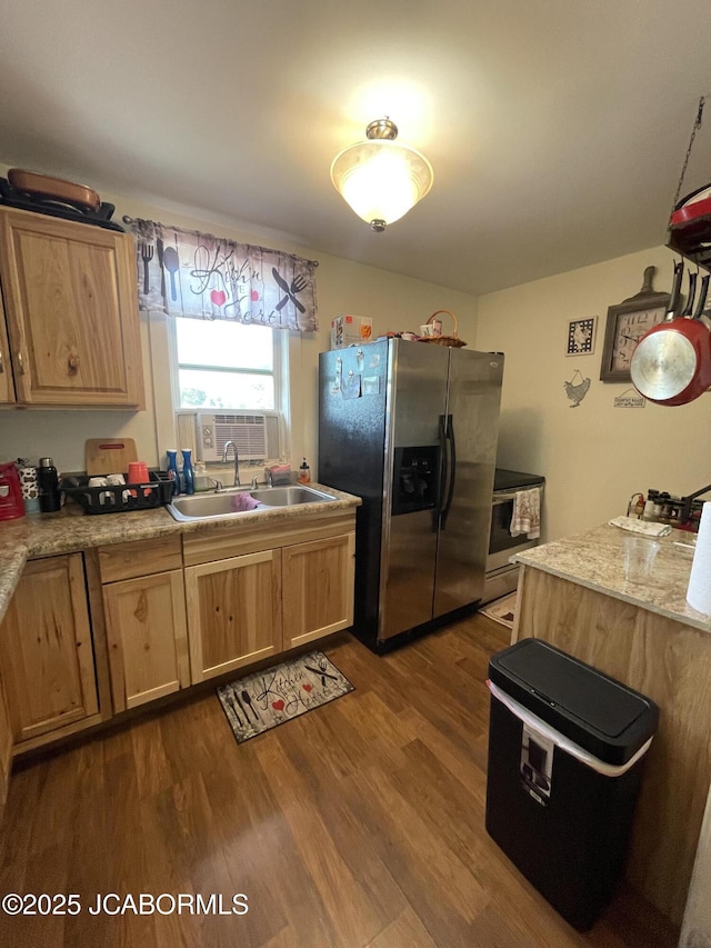 106 S Main St, Chamois, MO 65024 - kitchen featuring stainless steel appliances, a sink, dark wood-style floors, light countertops, and light brown cabinets