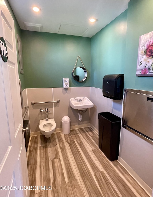 106 S Main St, Chamois, MO 65024 - bathroom with toilet, wood finished floors, baseboards, and recessed lighting