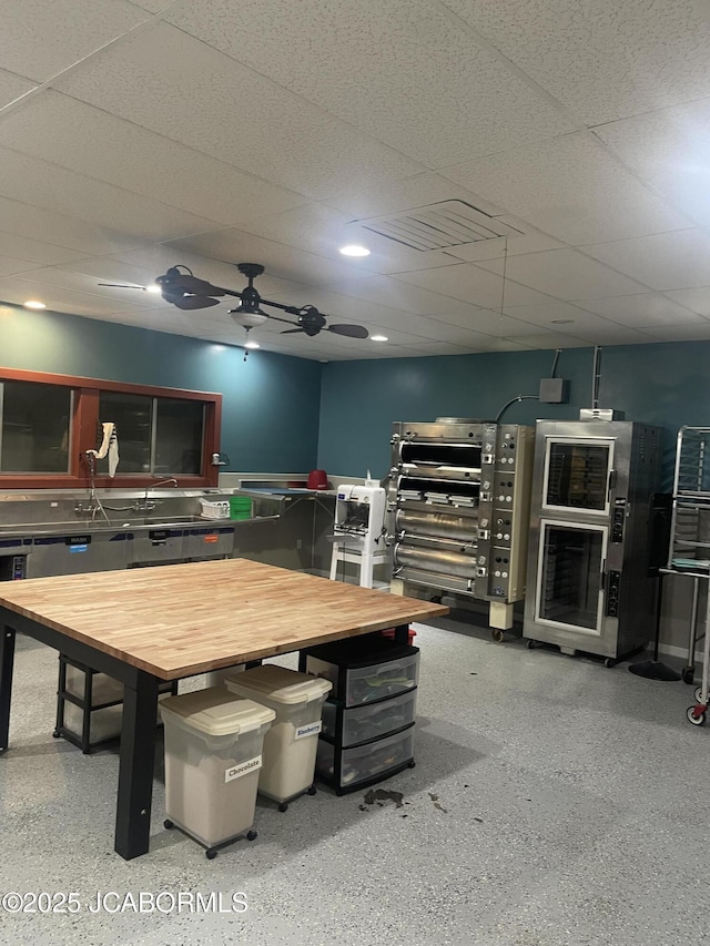 106 S Main St, Chamois, MO 65024 - dining space featuring speckle patterned floor and a ceiling fan