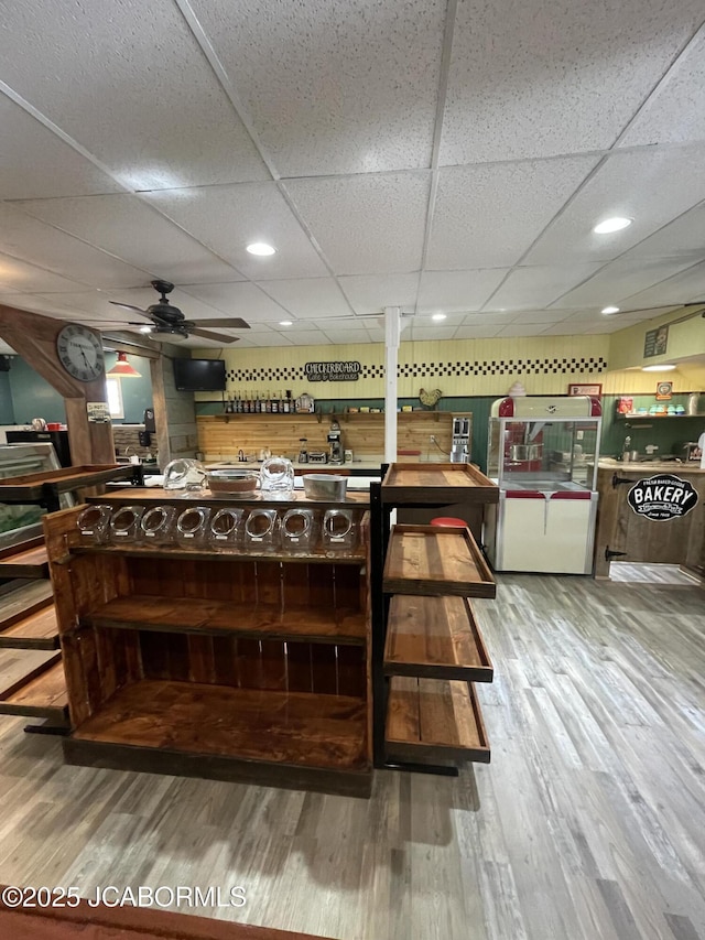106 S Main St, Chamois, MO 65024 - kitchen with a paneled ceiling, ceiling fan, and wood finished floors