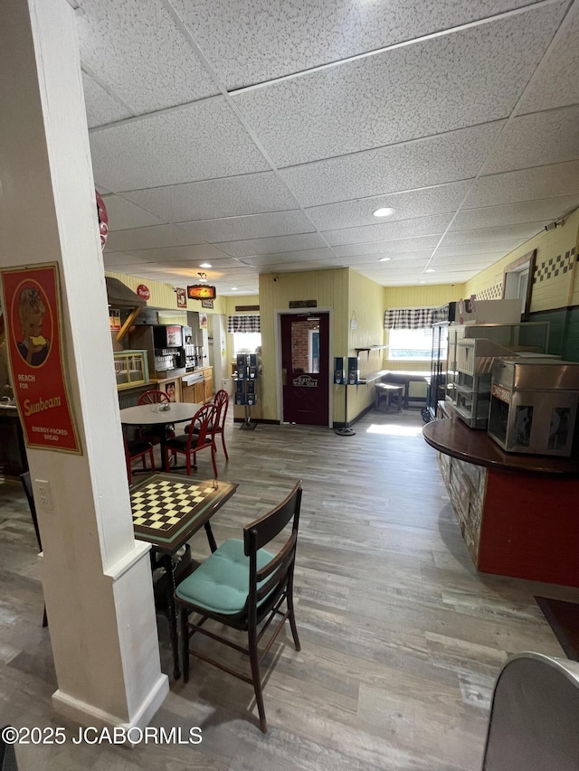 106 S Main St, Chamois, MO 65024 - dining room featuring a drop ceiling and wood finished floors