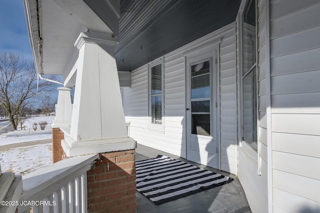 view of snow covered property entrance