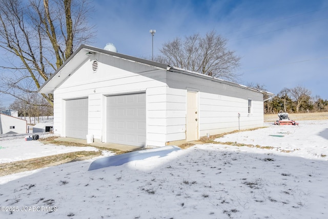 view of snow covered garage