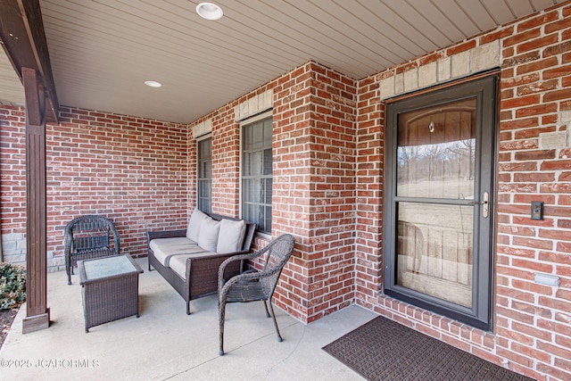 doorway to property featuring outdoor lounge area