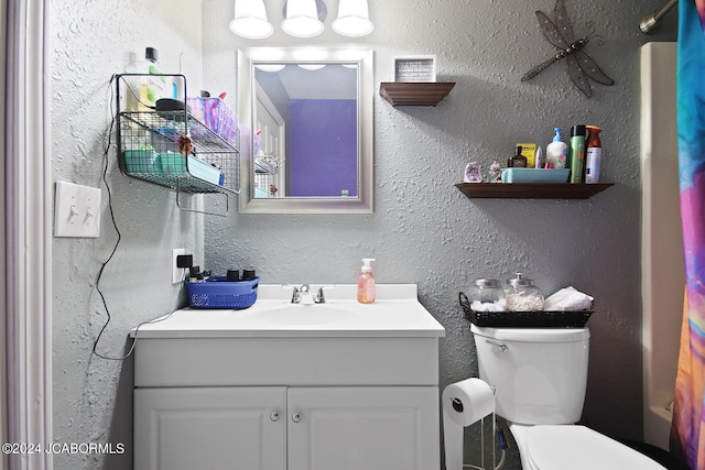 full bathroom featuring vanity, toilet, and shower / tub combo with curtain