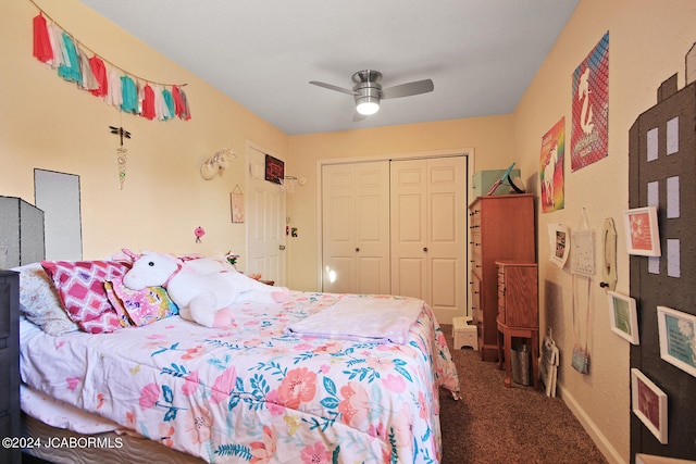 bedroom with ceiling fan, a closet, and dark carpet