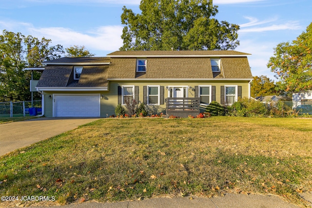 view of front facade featuring a front lawn and a garage